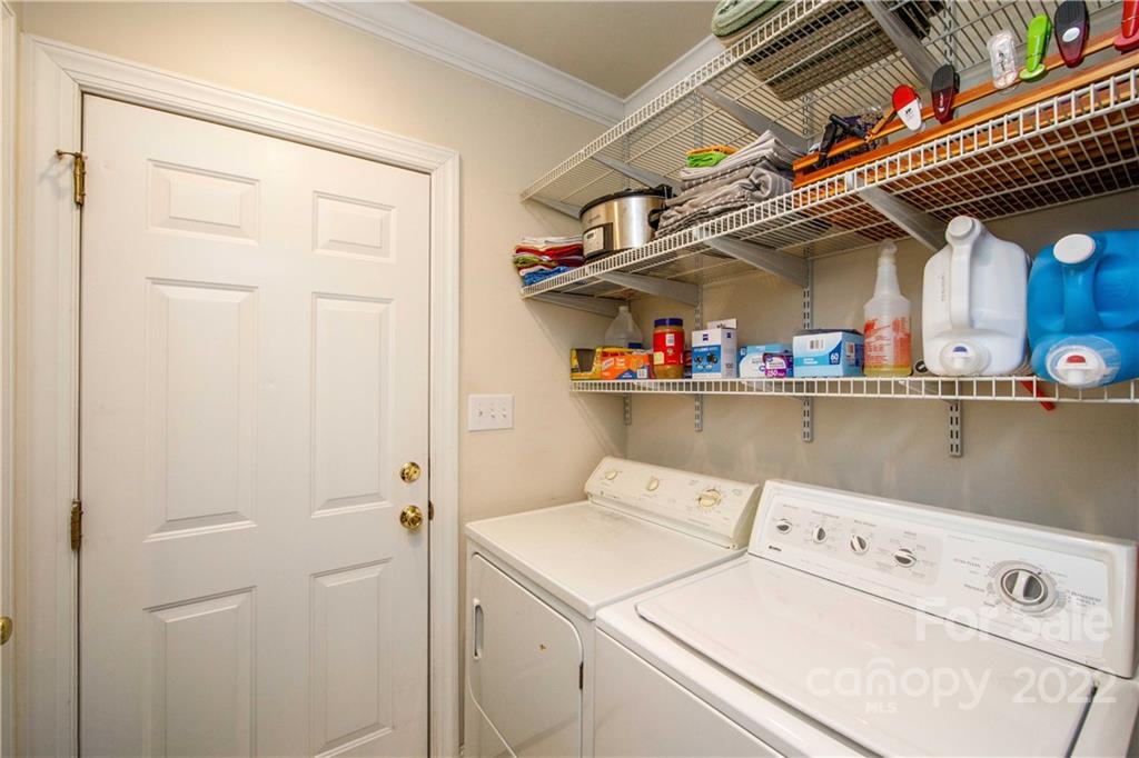 3200 Dublin Road Charlotte, NC 28208 - Photo 30 of 48 a view of storage and utility room with washer and dryer