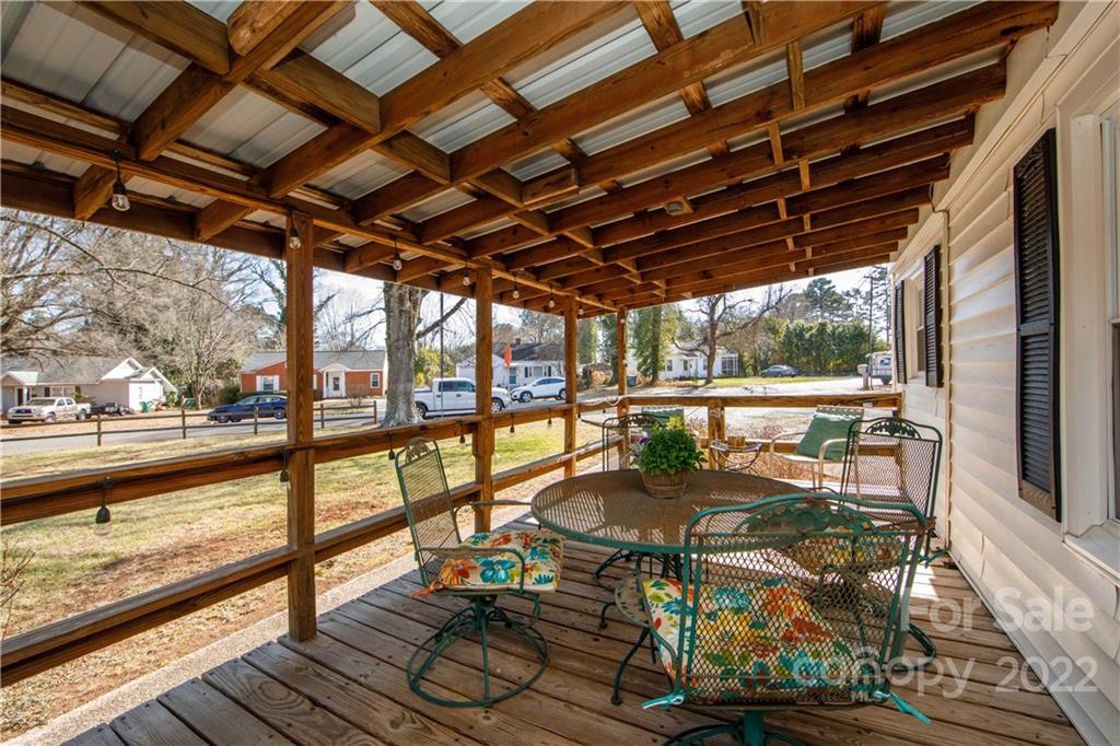 3200 Dublin Road Charlotte, NC 28208 - Photo 3 of 48 a view of a patio with lawn chairs and wooden floor