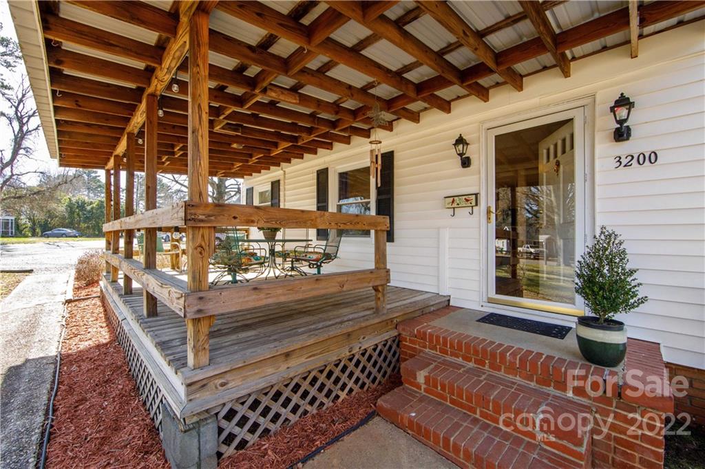 3200 Dublin Road Charlotte, NC 28208 - Photo 5 of 48 a view of a porch with furniture