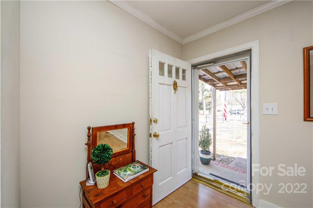3200 Dublin Road Charlotte, NC 28208 - Photo 6 of 48 a living room with furniture and a painting on the wall