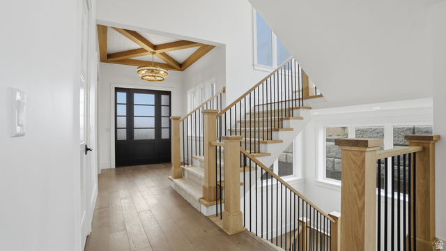 1682 North 1950 W Street, Unit 9 Provo, UT 84604 - Photo 38 of 84 Entryway featuring wood-finish flooring and a coffered ceiling with exposed wood beams