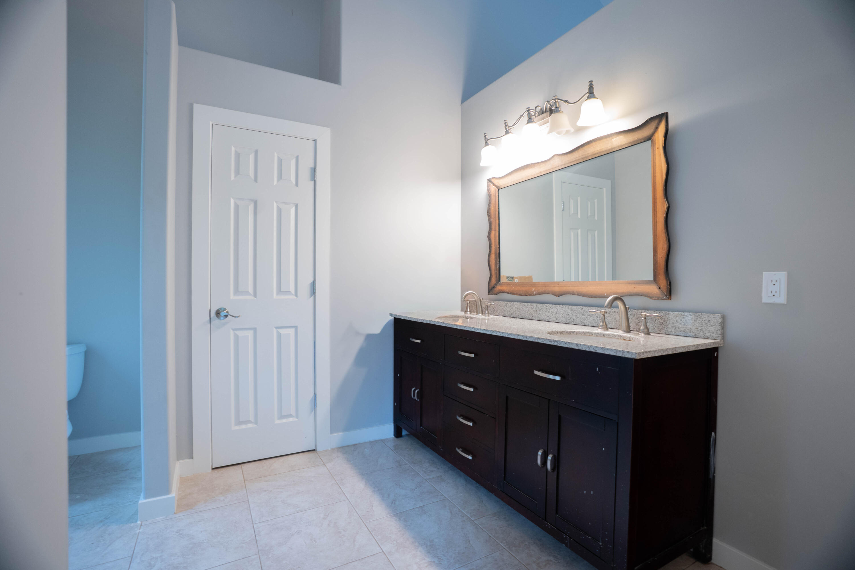 709 Pinewood Way Cave Junction, OR 97523 - Photo 13 of 24 a bathroom with a sink vanity and mirror