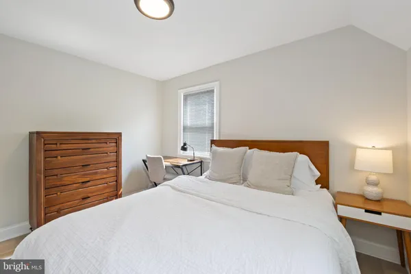 a bedroom with a bed and closet