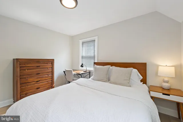 a bedroom with a bed and closet