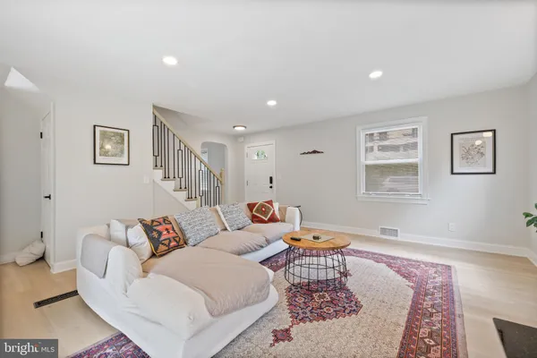 a living room with furniture and a rug