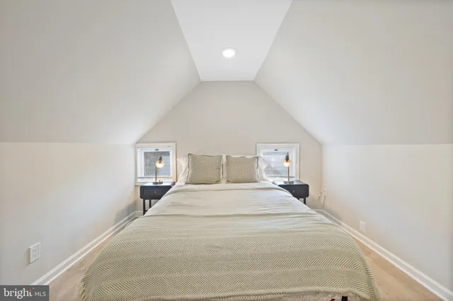 a bed room with a bed and a night stand