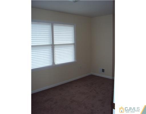 64 Helmetta Road Monroe Township, NJ 08831 - Photo 14 of 22 a view of an empty room with a window