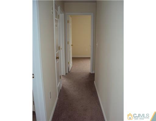 64 Helmetta Road Monroe Township, NJ 08831 - Photo 20 of 22 a view of a hallway with a white walls