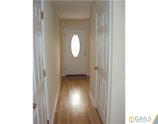 64 Helmetta Road Monroe Township, NJ 08831 - Photo 21 of 22 a view of a hallway with wooden floor