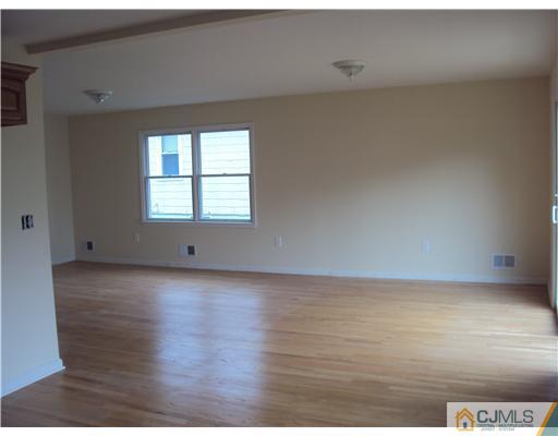 64 Helmetta Road Monroe Township, NJ 08831 - Photo 8 of 22 a view of a room that has wooden floor