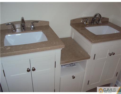64 Helmetta Road Monroe Township, NJ 08831 - Photo 10 of 22 a bathroom with a sink and a vanity