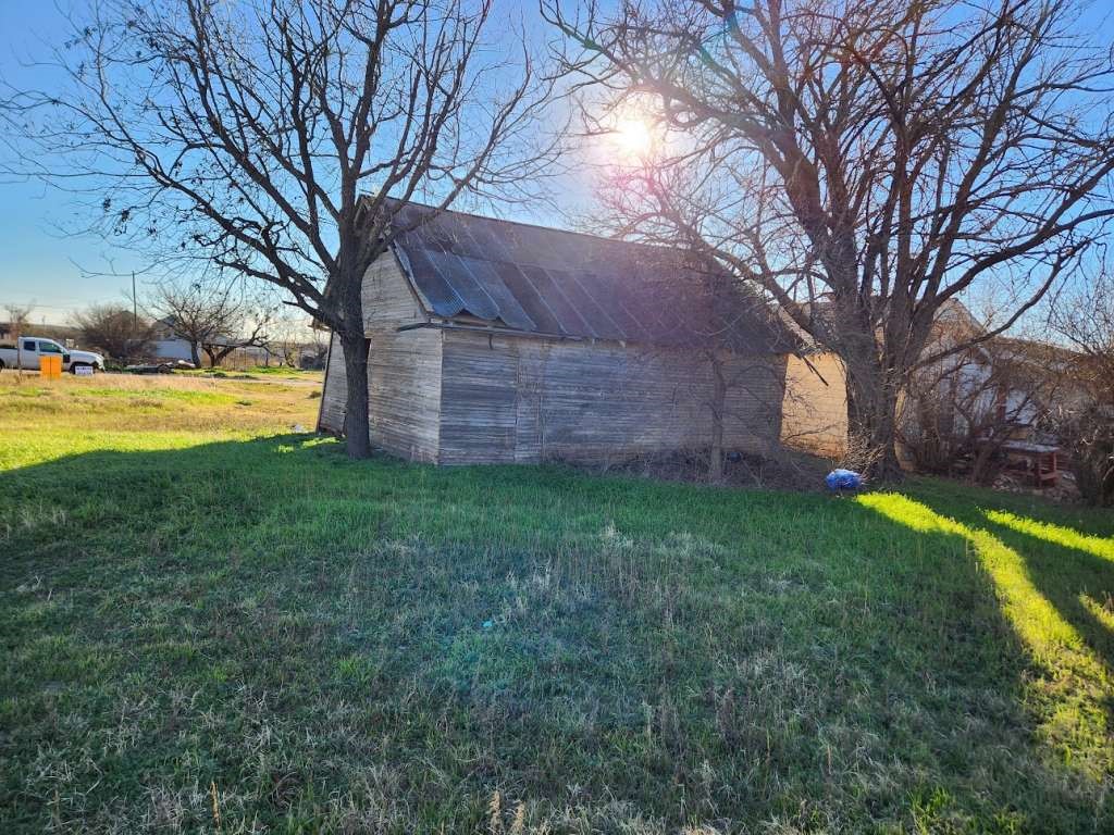 1226 Ave H Anson, TX 79501 - Photo 2 of 4 a view of a backyard with large tree