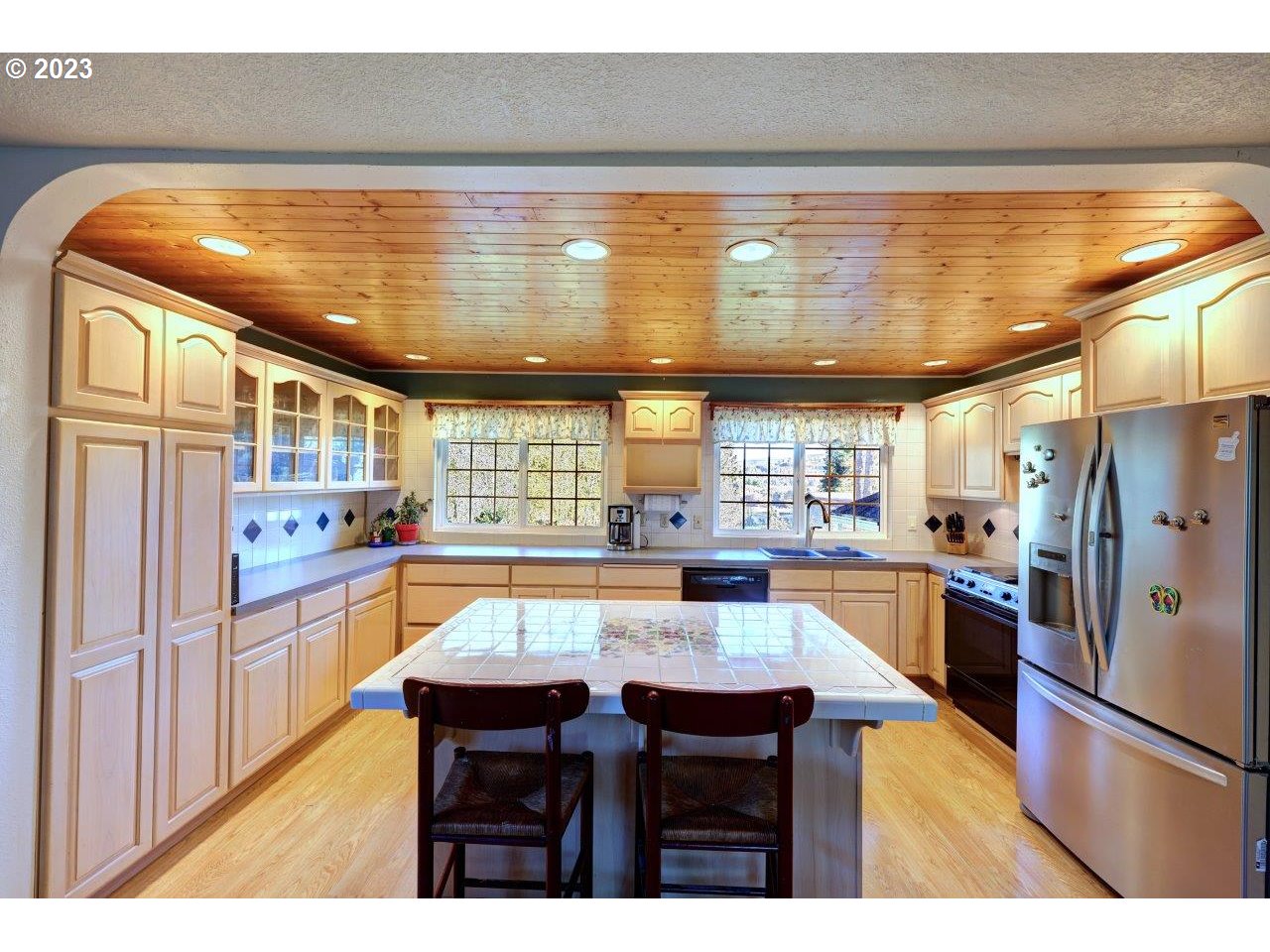 93066 Knappa Dock Road Astoria, OR 97103 - Photo 11 of 29 a kitchen with refrigerator and window