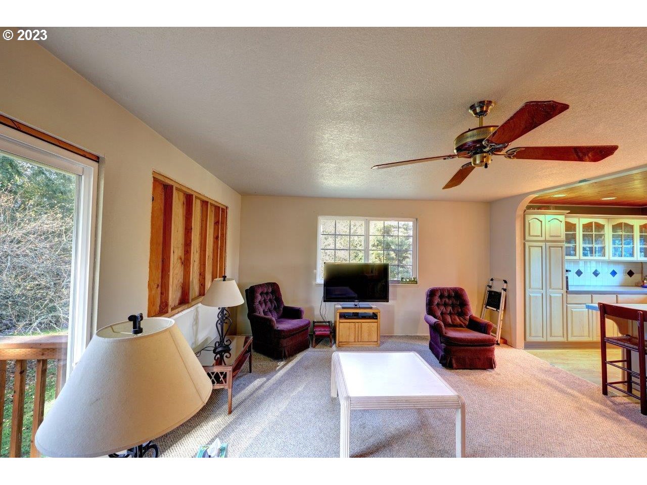 93066 Knappa Dock Road Astoria, OR 97103 - Photo 12 of 29 a living room with furniture and a flat screen tv