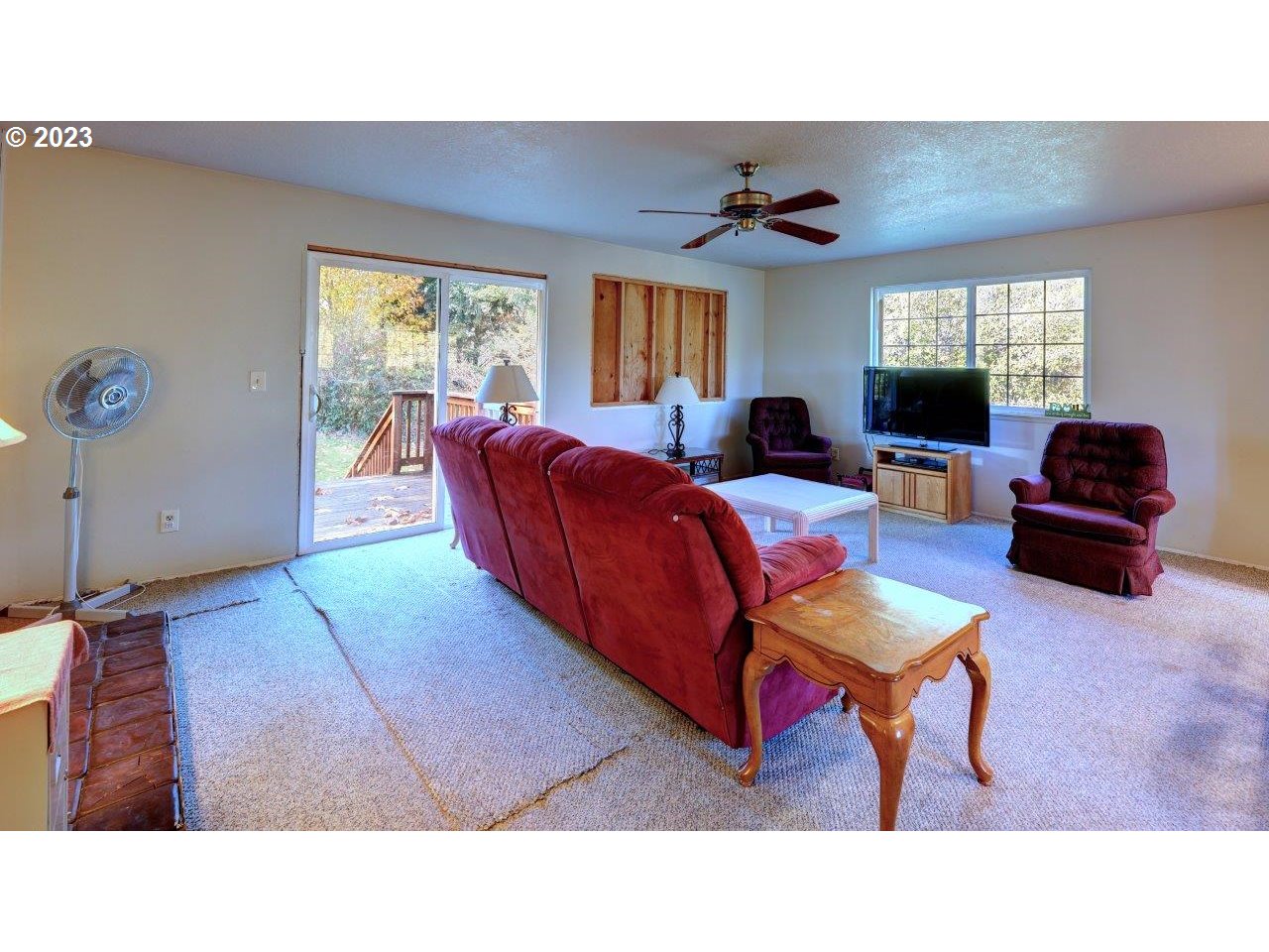 93066 Knappa Dock Road Astoria, OR 97103 - Photo 14 of 29 a living room with furniture a window and a flat screen tv