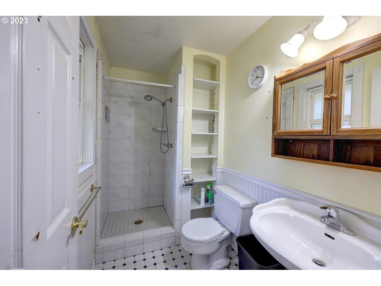 93066 Knappa Dock Road Astoria, OR 97103 - Photo 17 of 29 a bathroom with a sink toilet a shower and a mirror