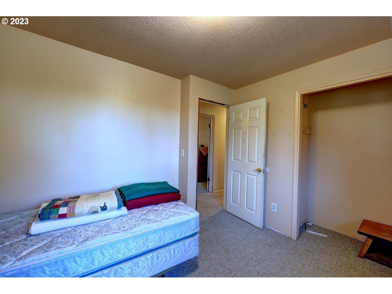 93066 Knappa Dock Road Astoria, OR 97103 - Photo 18 of 29 a bedroom with a bed and a dresser