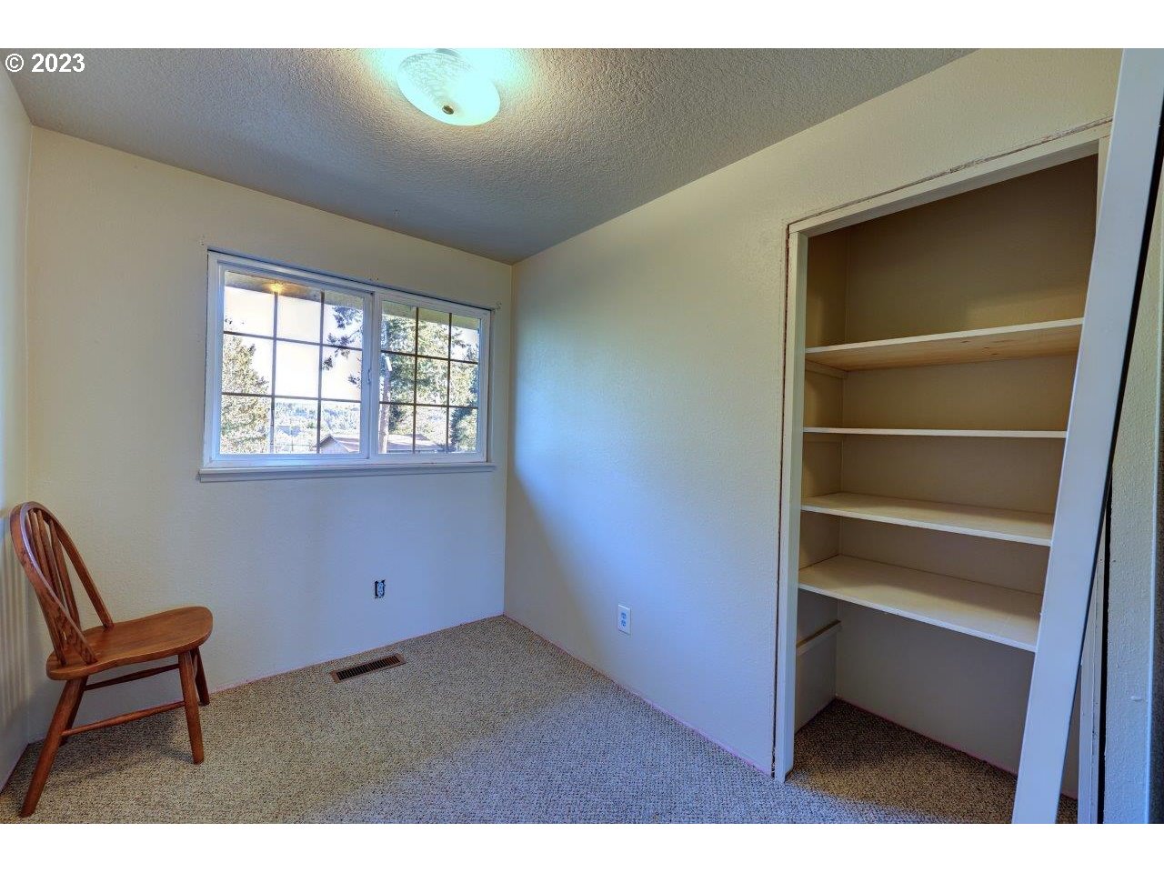 93066 Knappa Dock Road Astoria, OR 97103 - Photo 20 of 29 a room with a chair and a window