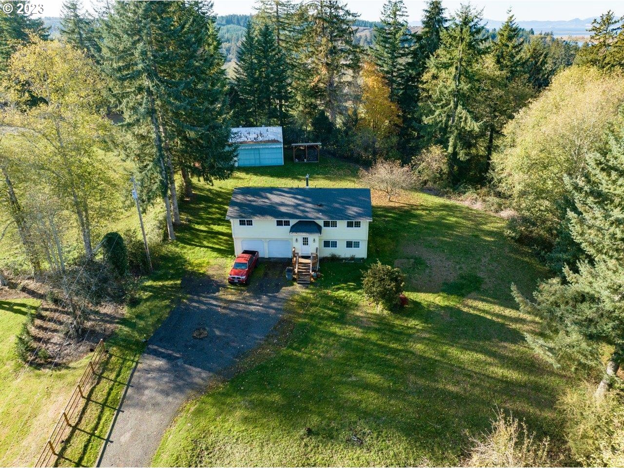 93066 Knappa Dock Road Astoria, OR 97103 - Photo 29 of 29 a green field covered with trees