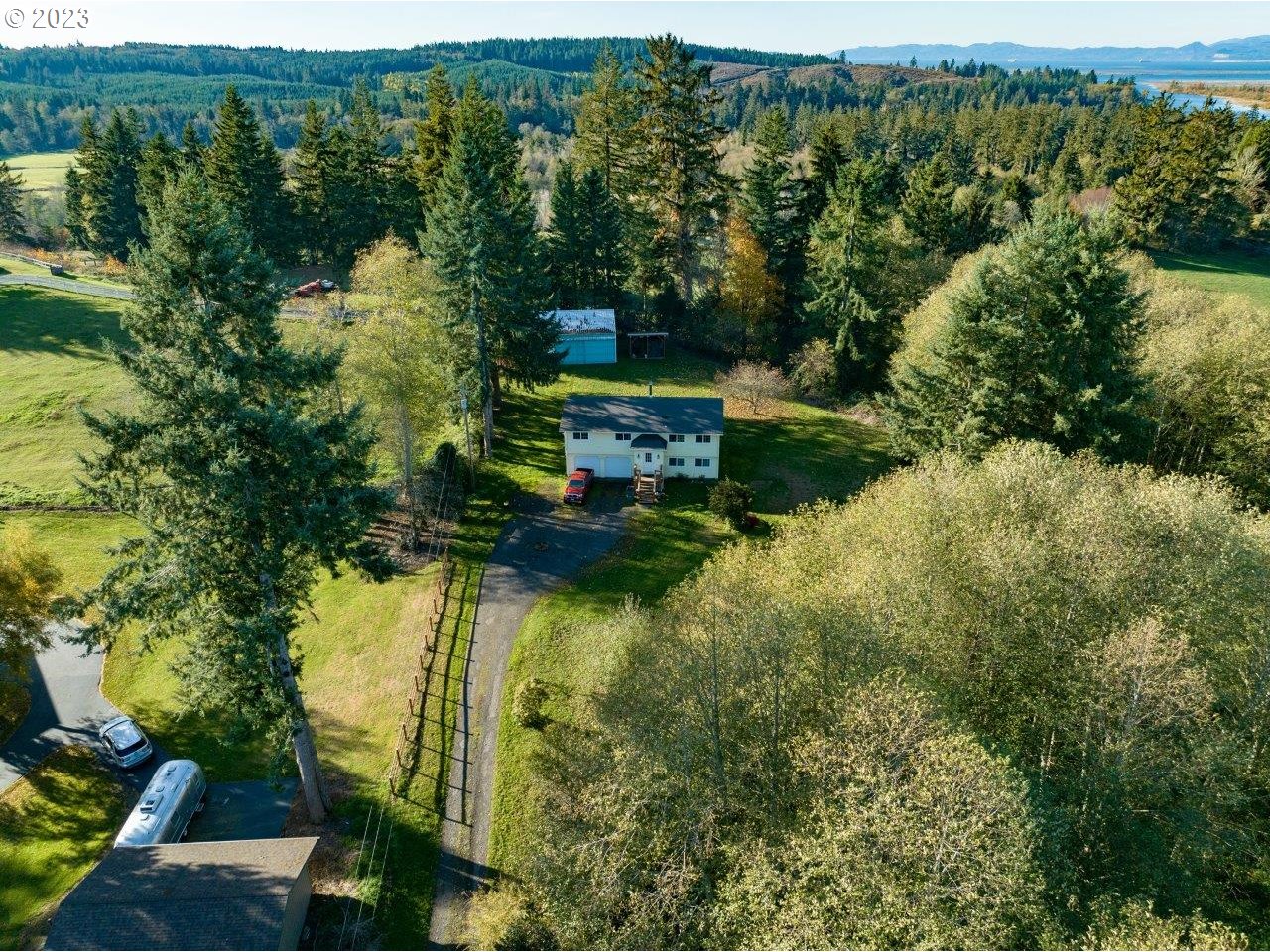 93066 Knappa Dock Road Astoria, OR 97103 - Photo 5 of 29 an aerial view of residential house with outdoor space and trees all around