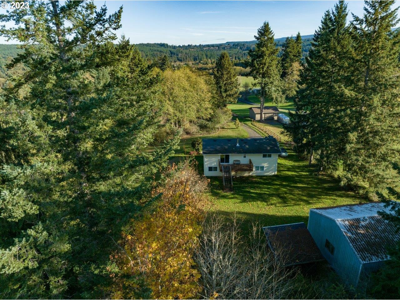 93066 Knappa Dock Road Astoria, OR 97103 - Photo 6 of 29 a backyard of a house with table and chairs