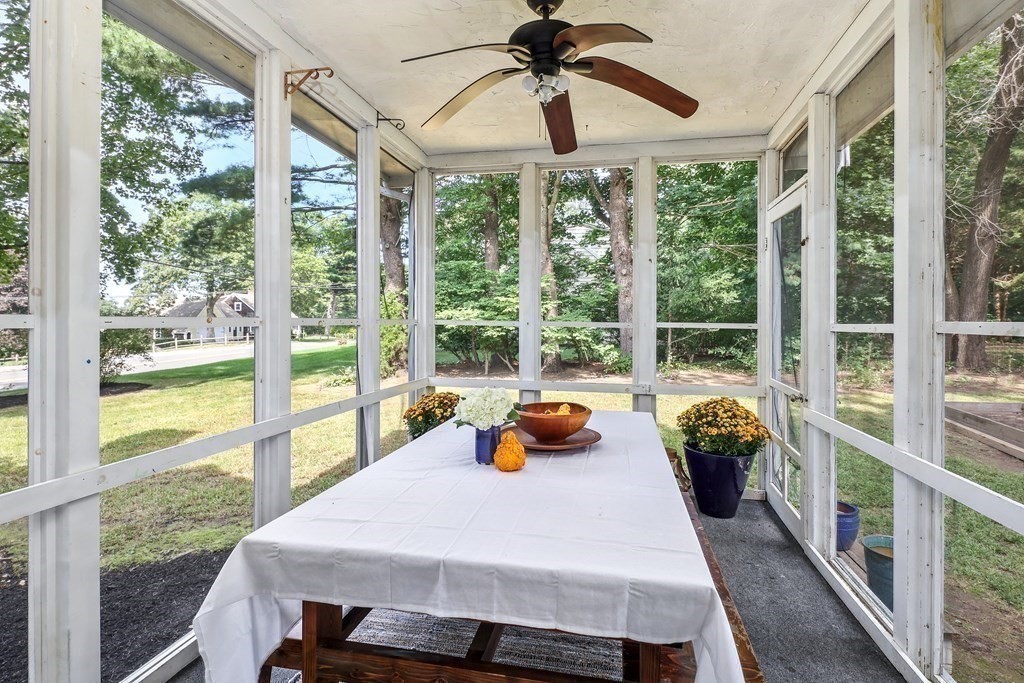 10 Colonial Road Hingham, MA 02043 - Photo 11 of 21 a dining room with wooden floor and a bed