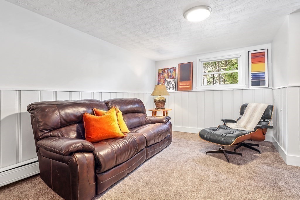 10 Colonial Road Hingham, MA 02043 - Photo 12 of 21 a living room with a couch and a window