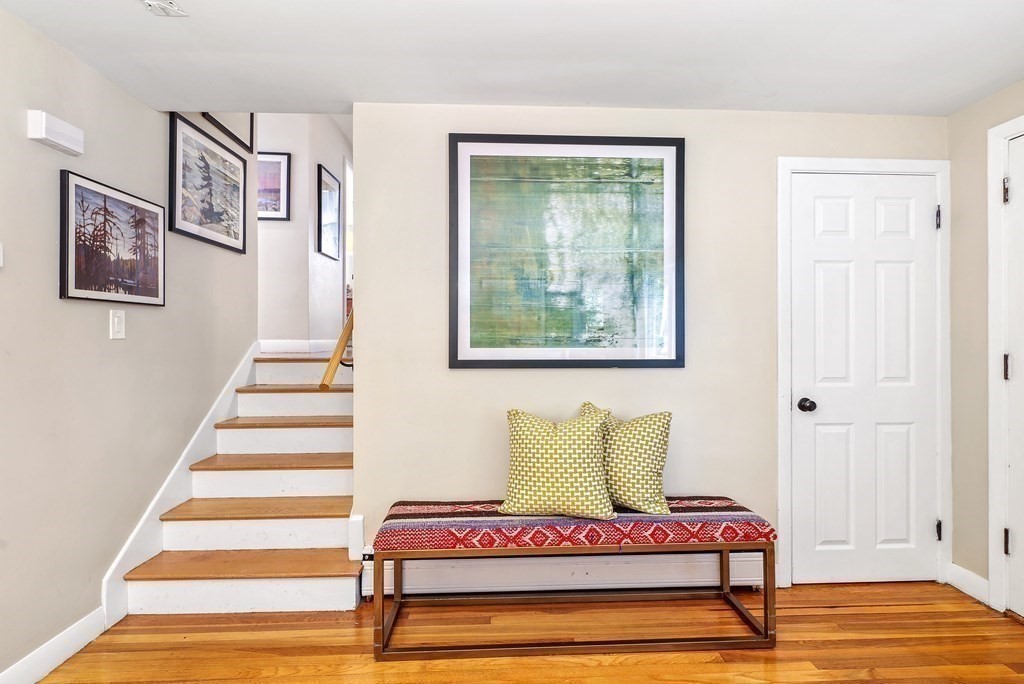 10 Colonial Road Hingham, MA 02043 - Photo 14 of 21 a bedroom with a bed and wooden floor