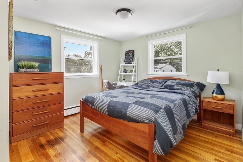 10 Colonial Road Hingham, MA 02043 - Photo 18 of 21 a bedroom with a bed and a window