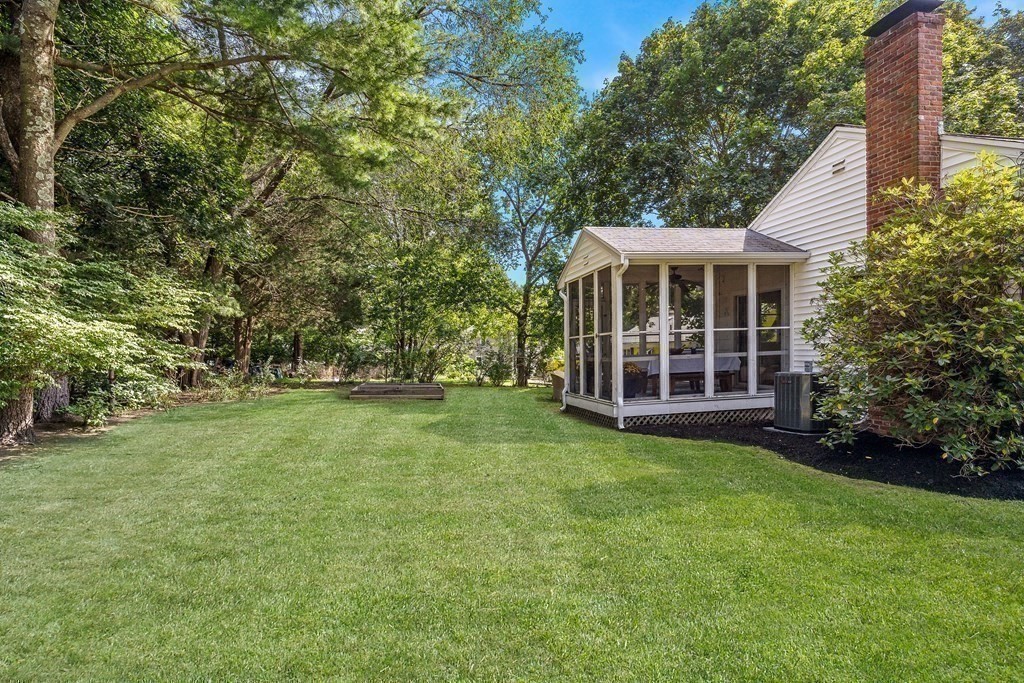 10 Colonial Road Hingham, MA 02043 - Photo 19 of 21 a view of a house with a backyard