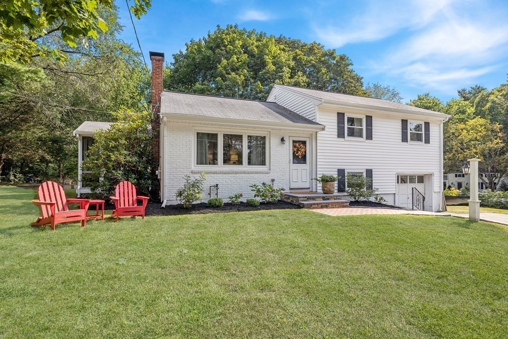10 Colonial Road Hingham, MA 02043 - Photo 2 of 21 a view of a house with backyard and sitting area