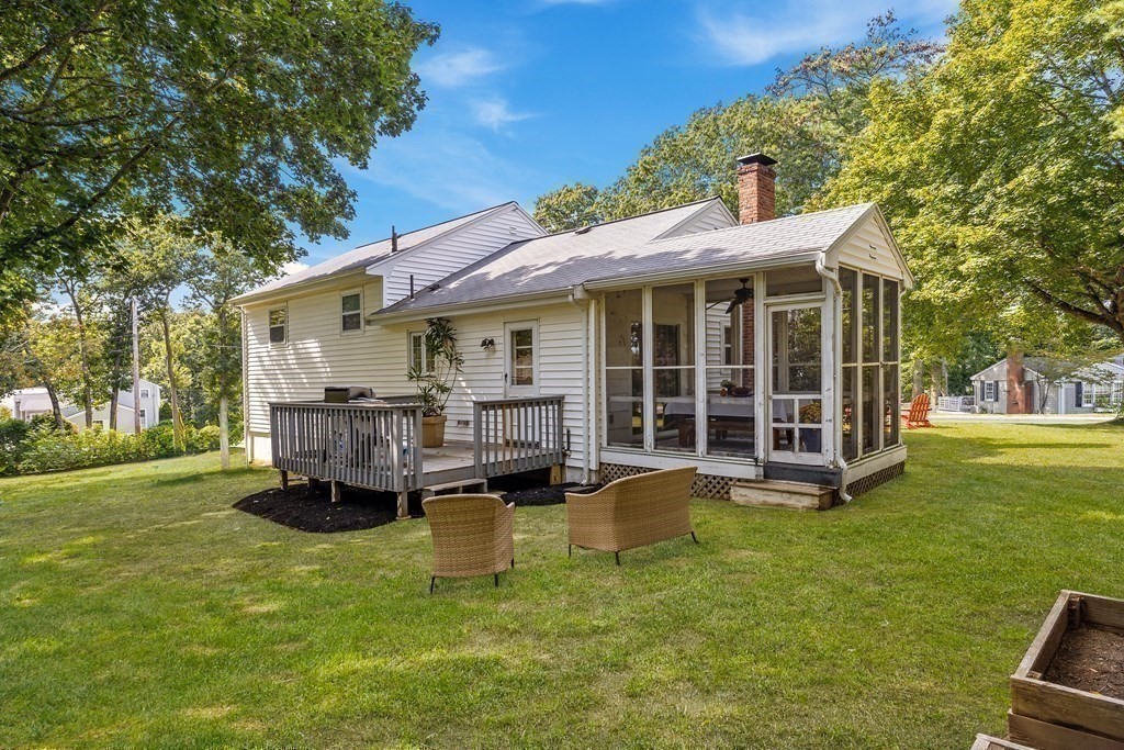 10 Colonial Road Hingham, MA 02043 - Photo 21 of 21 a view of a house with a yard and sitting area