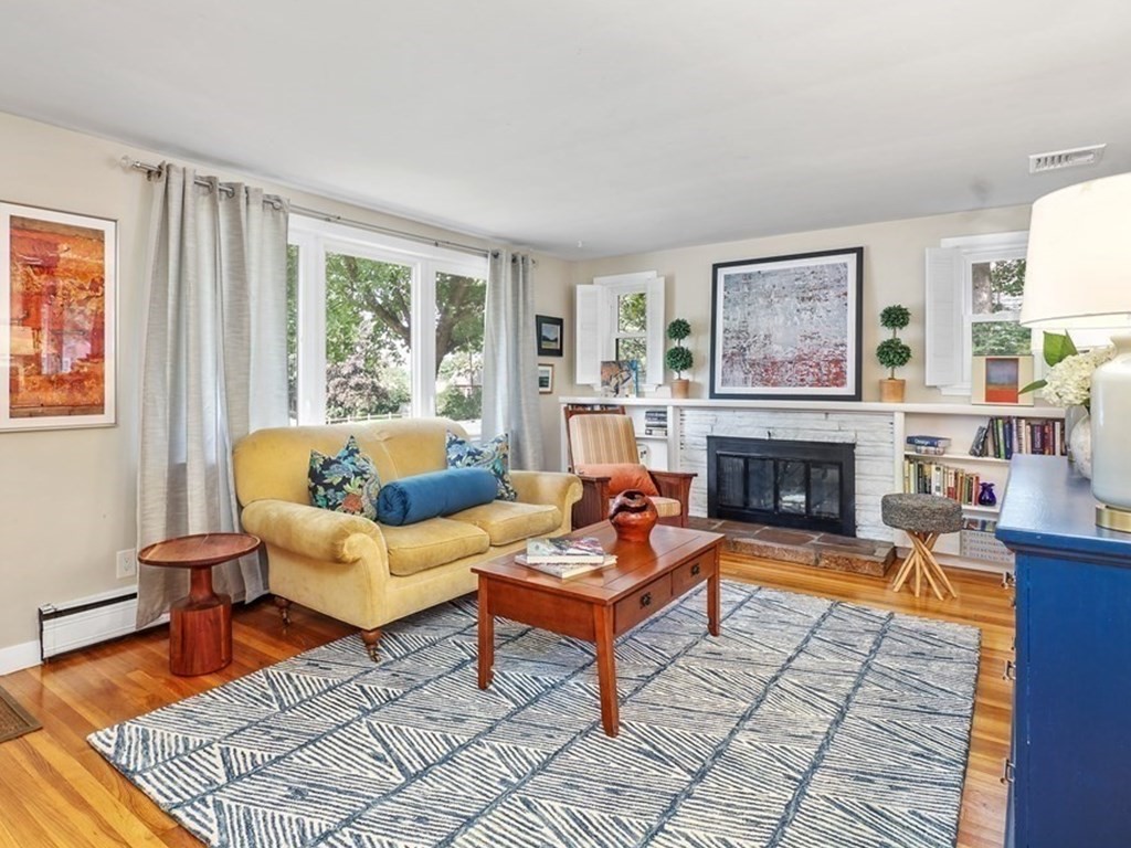 10 Colonial Road Hingham, MA 02043 - Photo 4 of 21 a living room with furniture and a fireplace