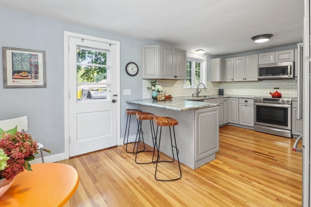 10 Colonial Road Hingham, MA 02043 - Photo 8 of 21 a kitchen with a sink cabinets and window