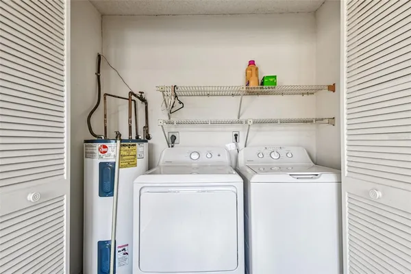an aerial view of a houses with a yard