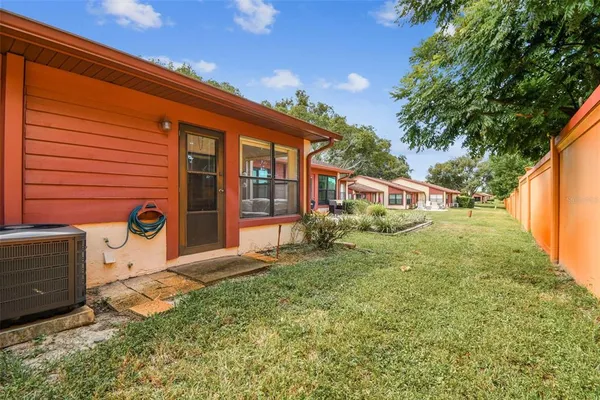 an aerial view of a house with outdoor space pool seating area and fire pit