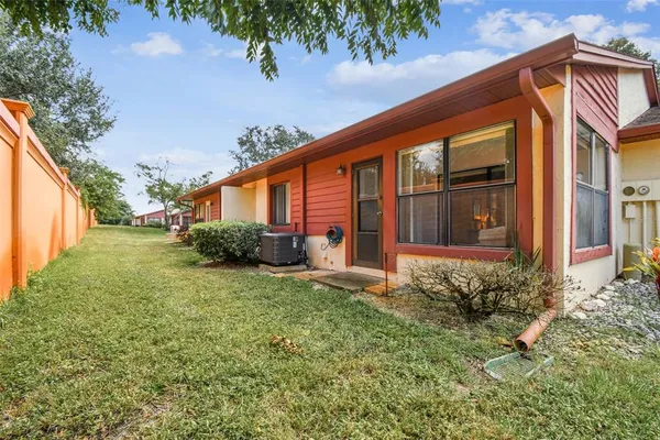 an aerial view of residential houses with outdoor space and street view