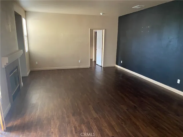 a view of a livingroom with wooden floor