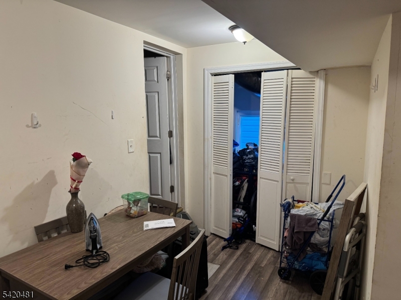 65 Stone Street Newark, NJ 07104 - Photo 11 of 37 a room with furniture and wooden floor