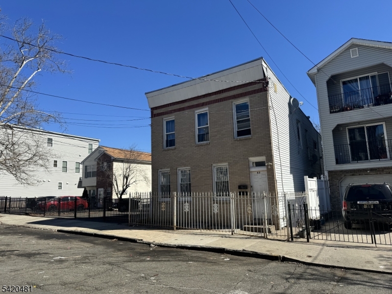 65 Stone Street Newark, NJ 07104 - Photo 2 of 37 a front view of a building with street