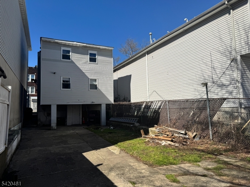 65 Stone Street Newark, NJ 07104 - Photo 5 of 37 a front view of a house with garage
