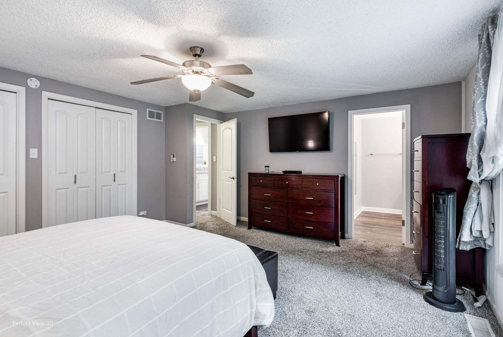 20131 East Brightway Road Mokena, IL 60448 - Photo 12 of 26 a bedroom with a bed and a flat screen tv
