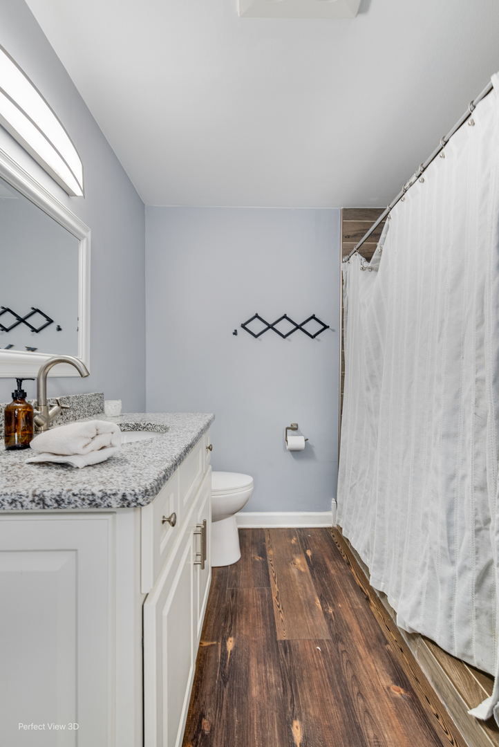 20131 East Brightway Road Mokena, IL 60448 - Photo 13 of 26 a bathroom with a granite countertop sink toilet and shower