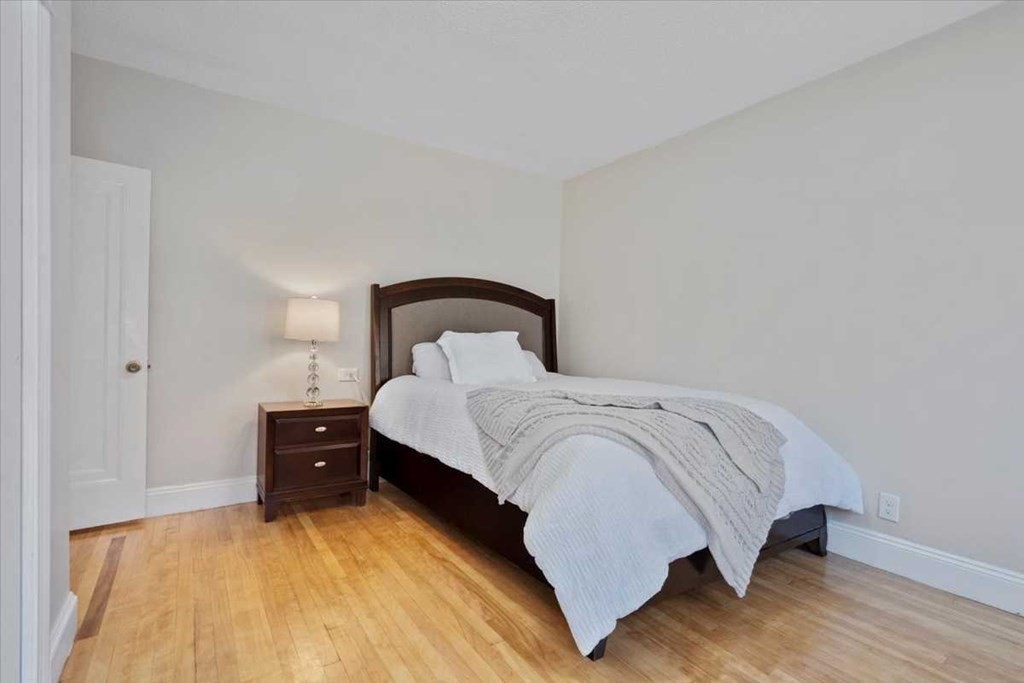 5 Locust Avenue Worcester, MA 01604 - Photo 11 of 40 a bedroom with a bed and a night stand