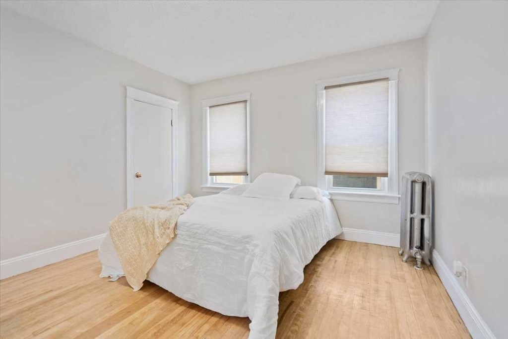 5 Locust Avenue Worcester, MA 01604 - Photo 13 of 40 a bedroom with a bed and a table