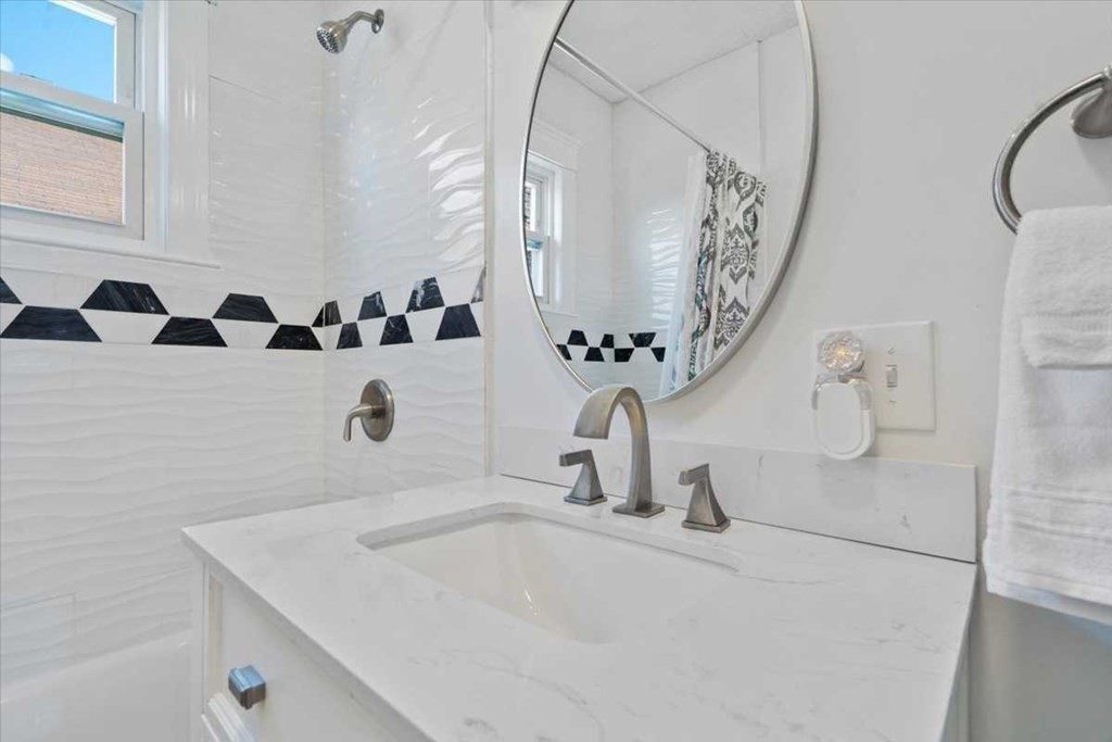 5 Locust Avenue Worcester, MA 01604 - Photo 15 of 40 a bathroom with a sink and mirror