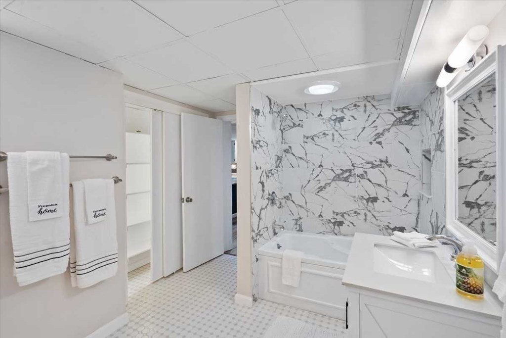 5 Locust Avenue Worcester, MA 01604 - Photo 26 of 40 a bathroom with a bathtub and a shower