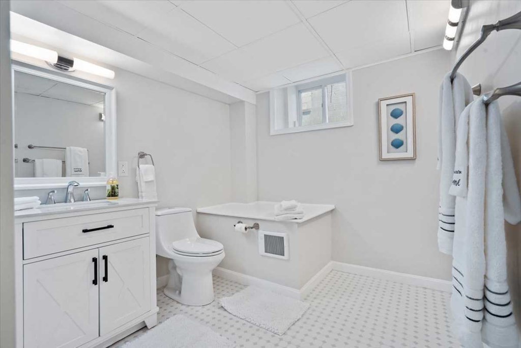 5 Locust Avenue Worcester, MA 01604 - Photo 27 of 40 a bathroom with a sink a toilet and a mirror