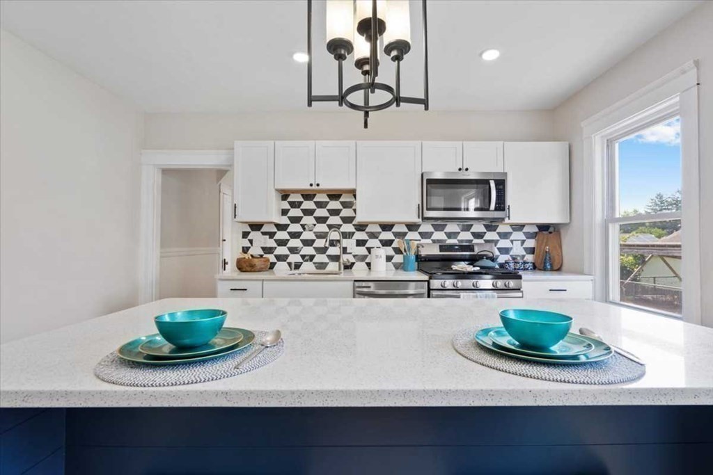 5 Locust Avenue Worcester, MA 01604 - Photo 9 of 40 a kitchen with a sink and a stove top oven