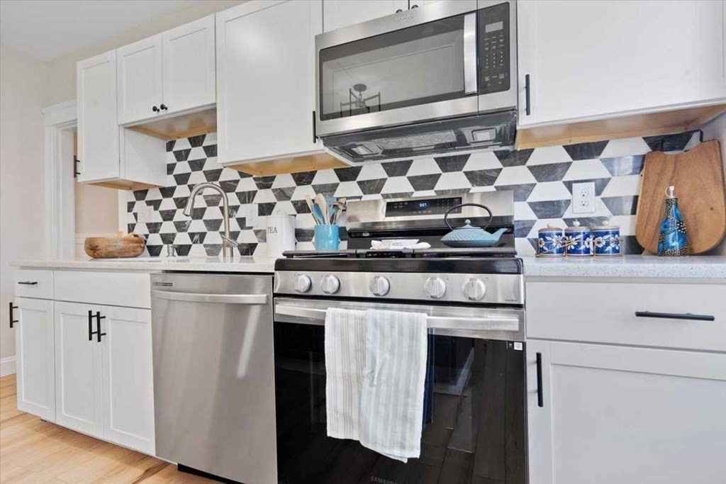 5 Locust Avenue Worcester, MA 01604 - Photo 10 of 40 a kitchen with a stove and a refrigerator